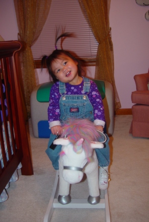 Kasen and her rocking horse